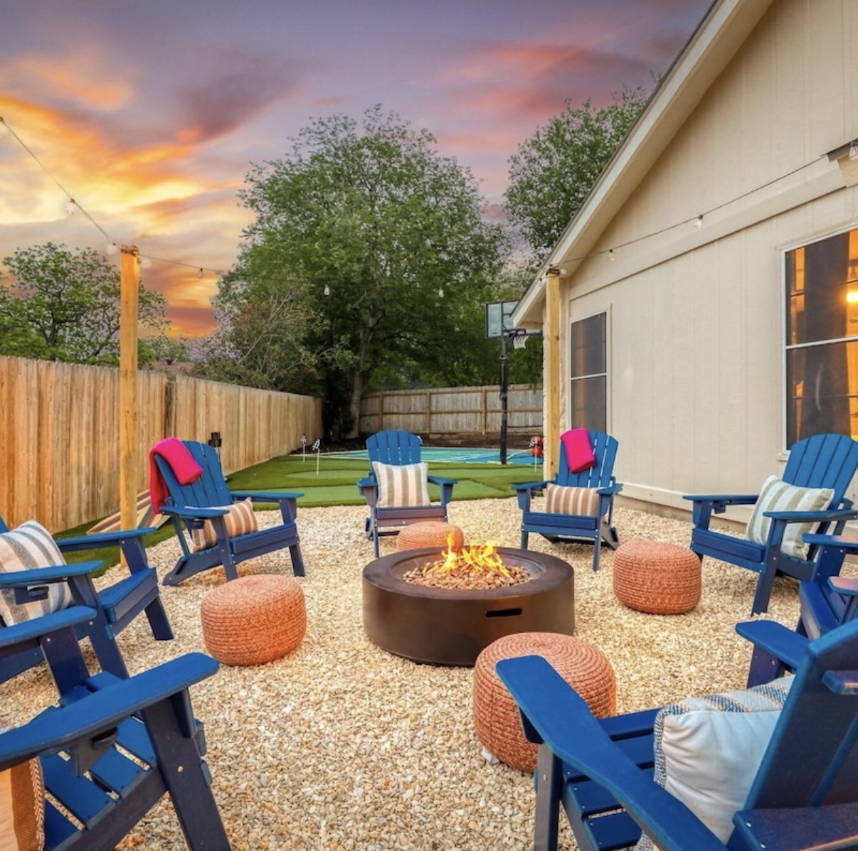 The fire pit glowing at golden hour