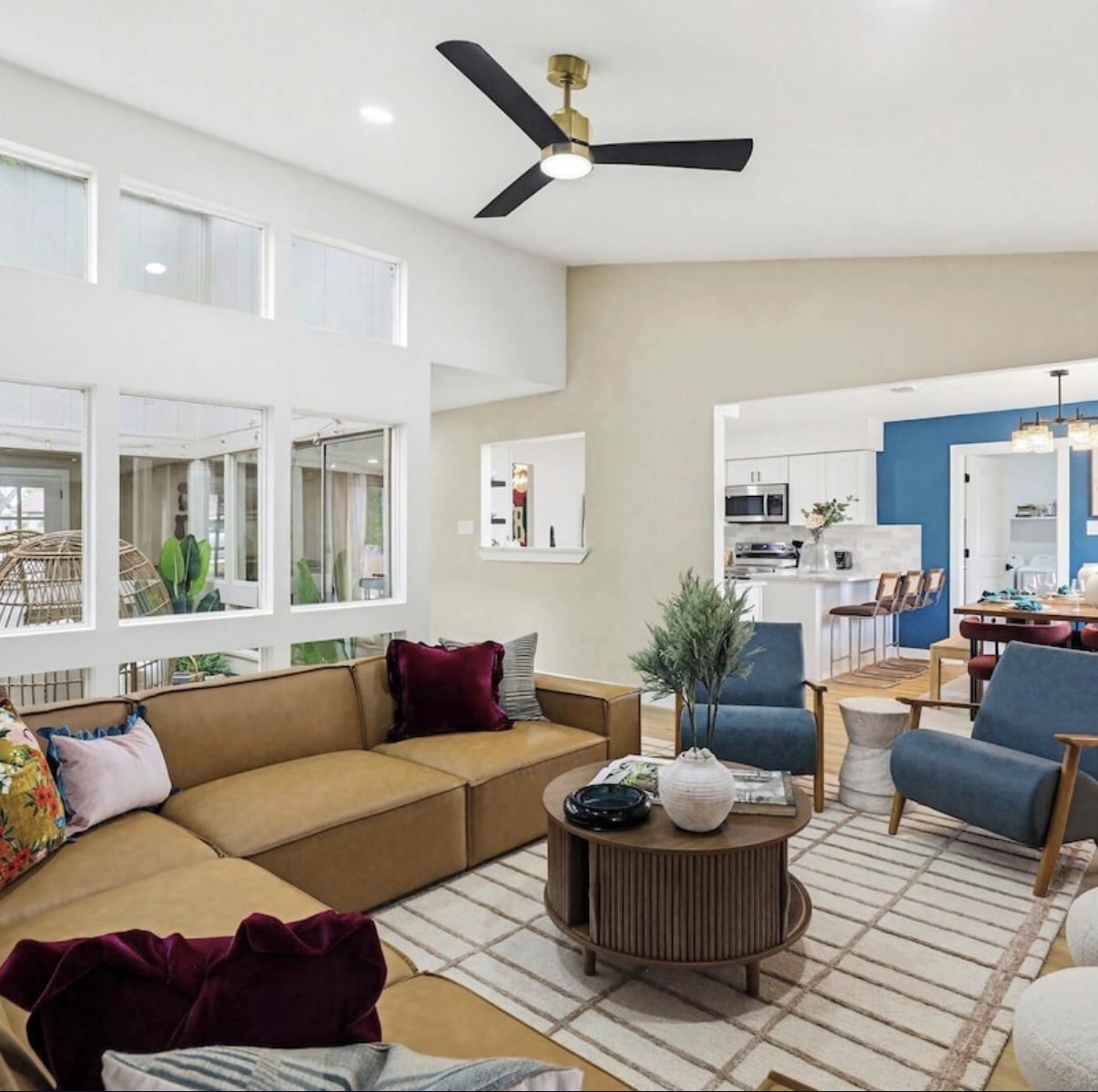 Open-concept living room with stone fireplace
